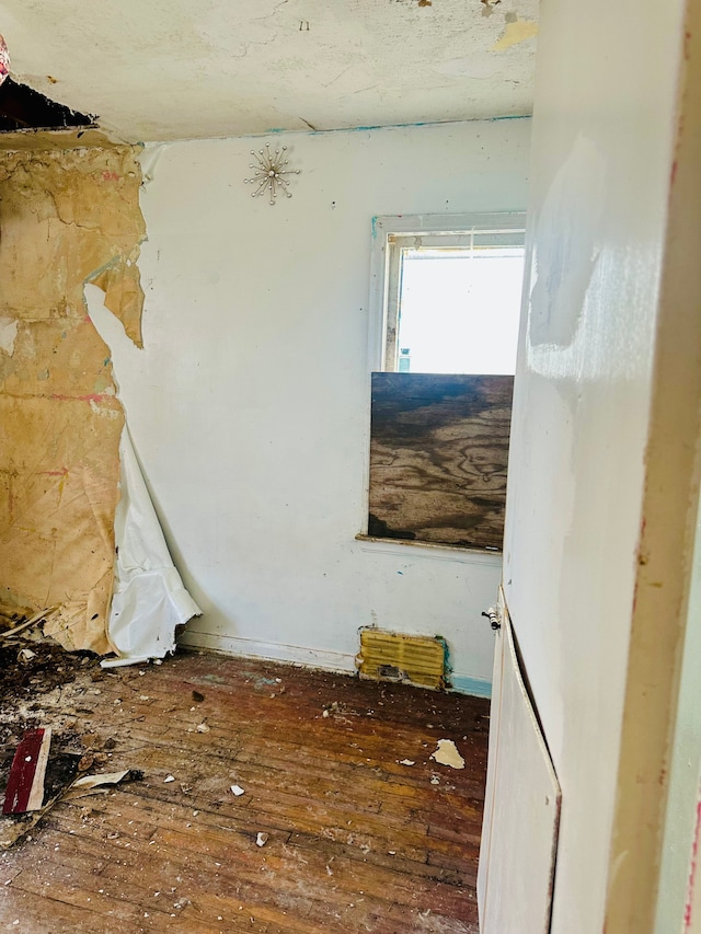 empty room featuring hardwood / wood-style flooring