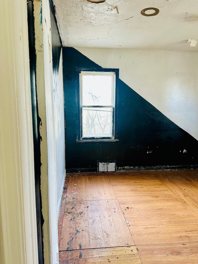 unfurnished room featuring hardwood / wood-style floors