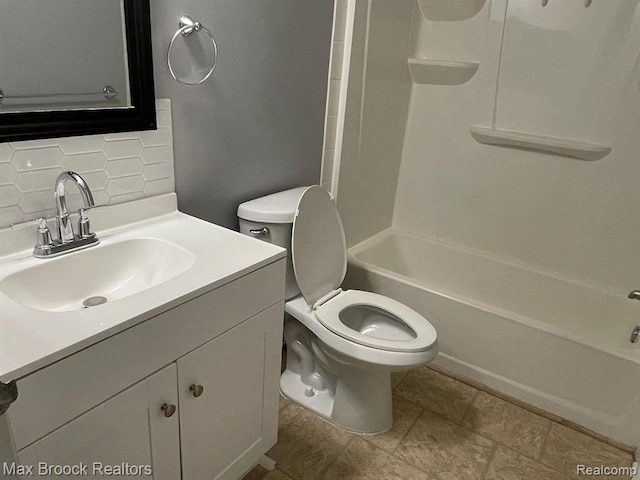 full bathroom with decorative backsplash, toilet, shower / bath combination, and vanity