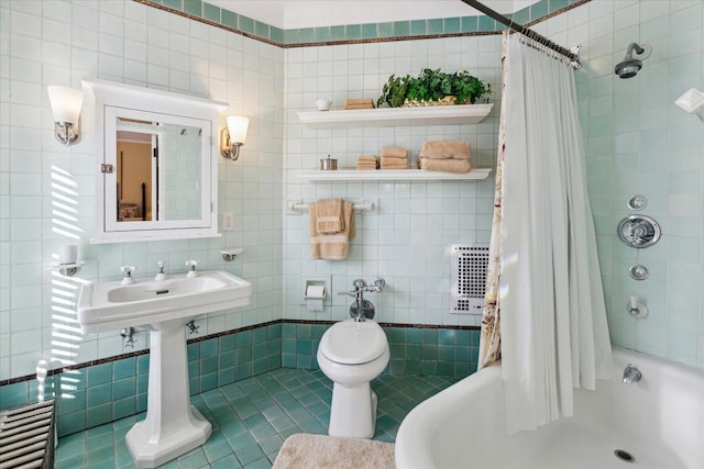 full bathroom featuring tile patterned floors, shower / bath combo, toilet, and tile walls