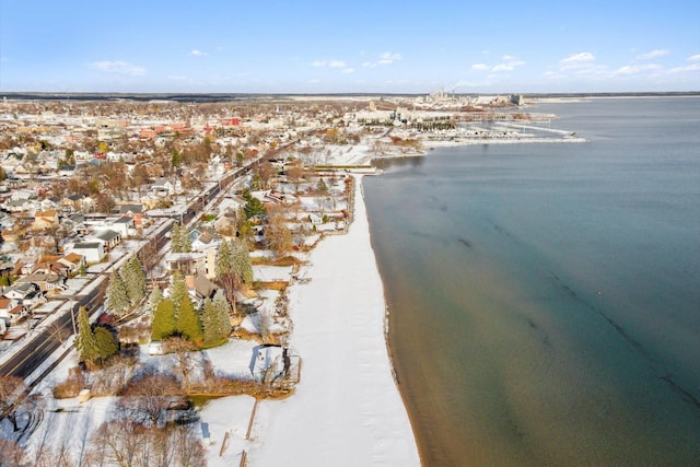 birds eye view of property with a beach view and a water view