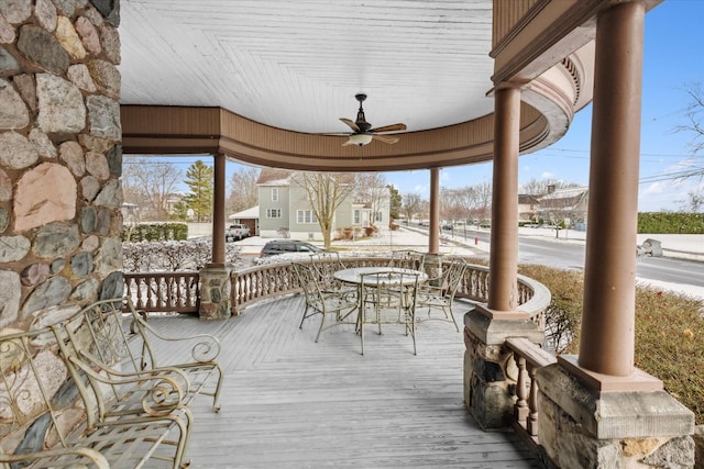 wooden deck with covered porch and ceiling fan