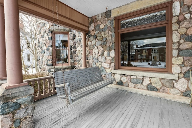 wooden terrace featuring covered porch