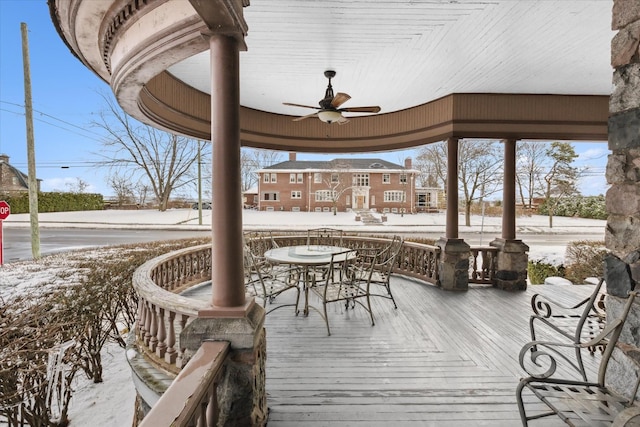 snow covered deck with ceiling fan