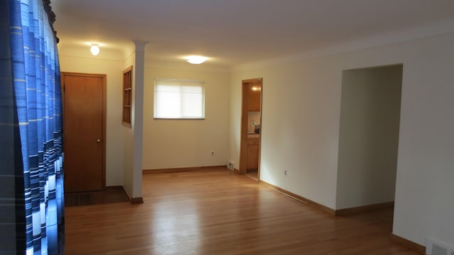 spare room featuring hardwood / wood-style floors