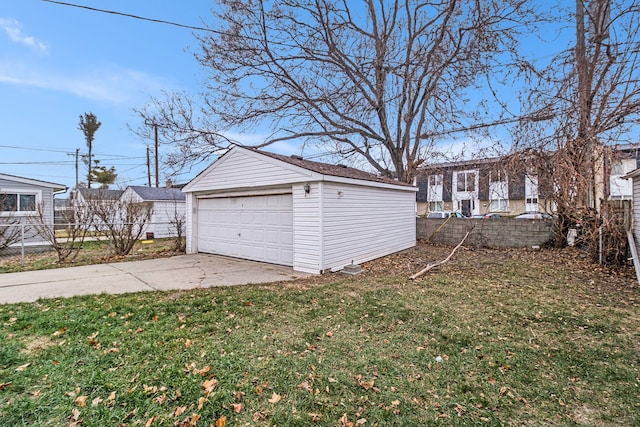 garage featuring a lawn