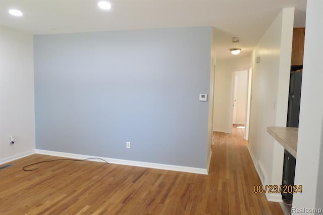 spare room featuring light hardwood / wood-style flooring