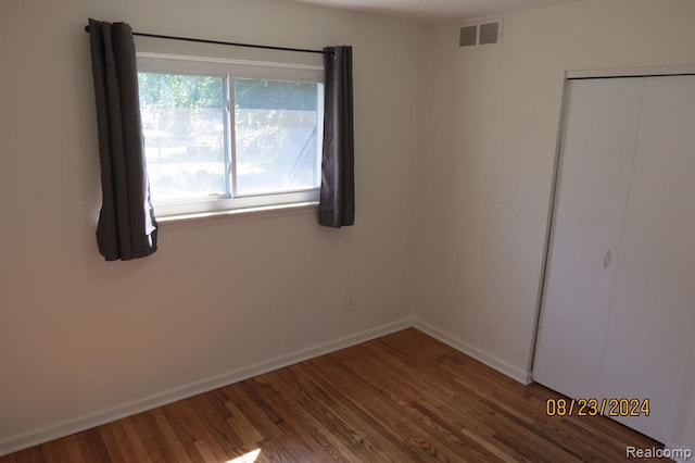 unfurnished bedroom featuring wood-type flooring