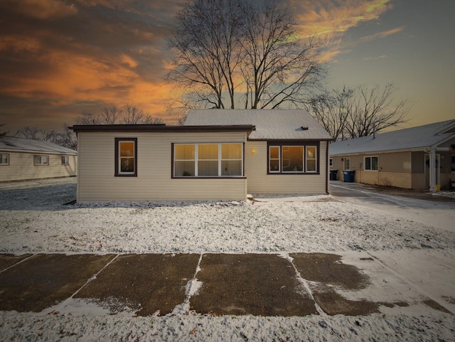 view of back house at dusk