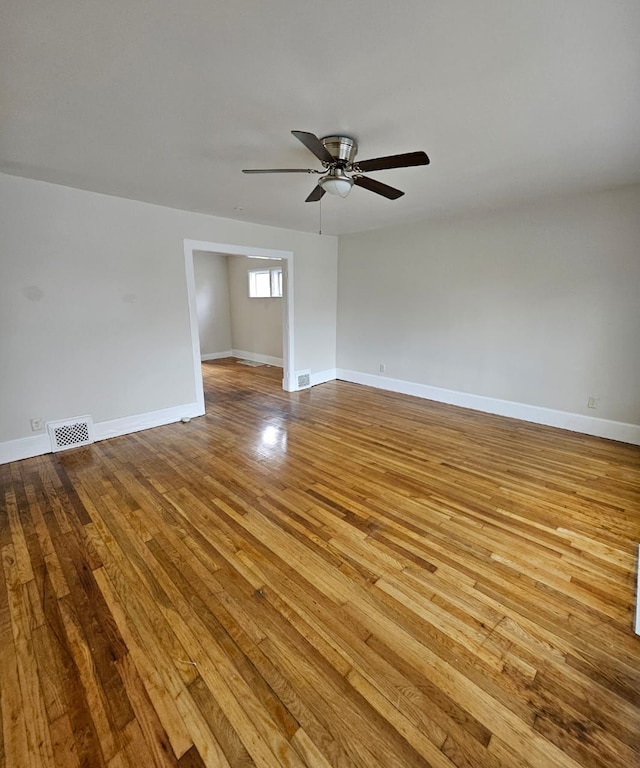 unfurnished room with ceiling fan and light hardwood / wood-style flooring