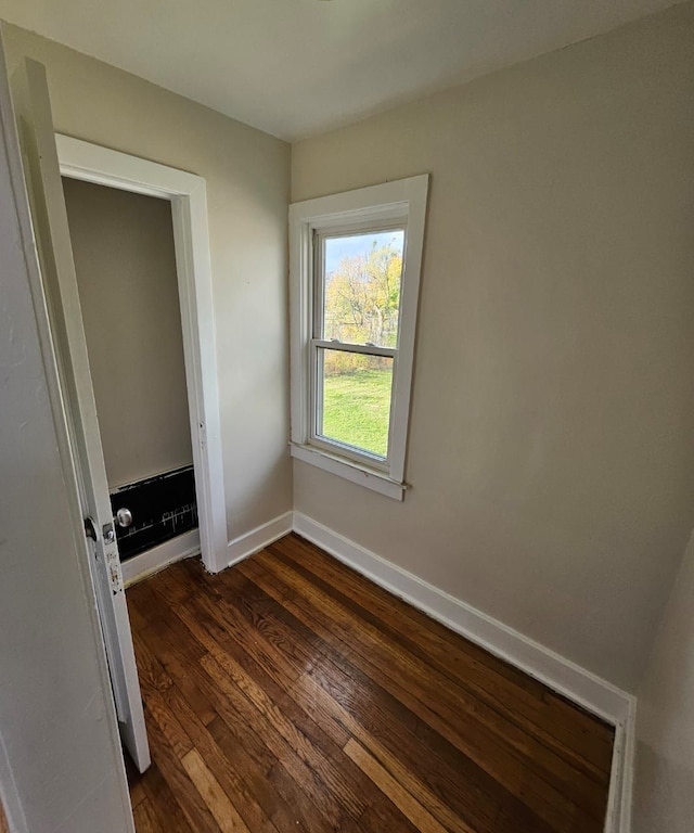 spare room featuring dark hardwood / wood-style floors