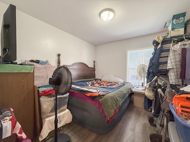 bedroom with hardwood / wood-style floors