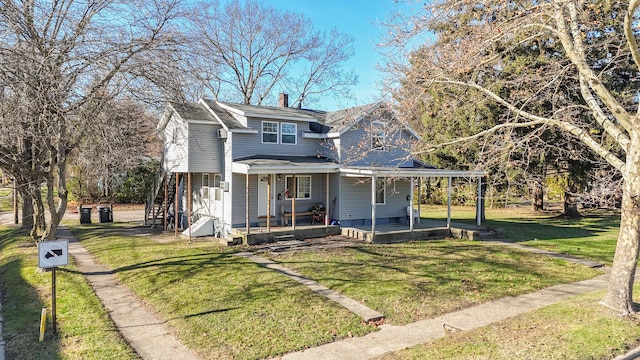 view of front of property featuring a front lawn and covered porch