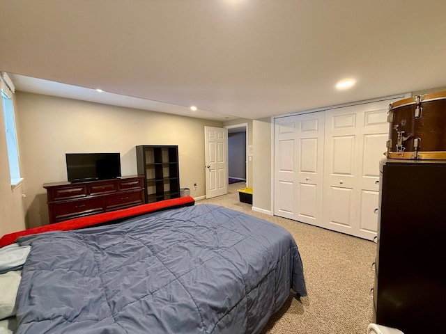 carpeted bedroom with a closet