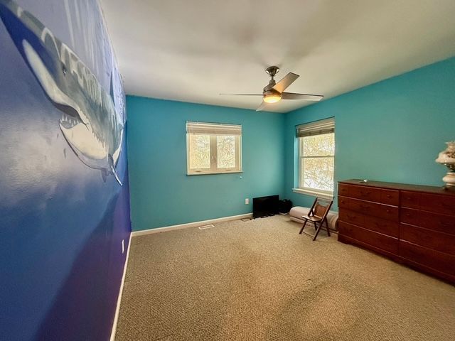 bedroom featuring carpet flooring and ceiling fan