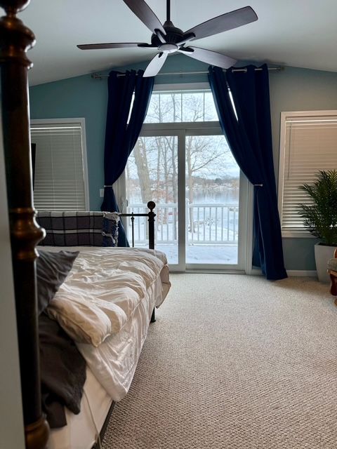 bedroom featuring access to exterior, carpet flooring, ceiling fan, and lofted ceiling