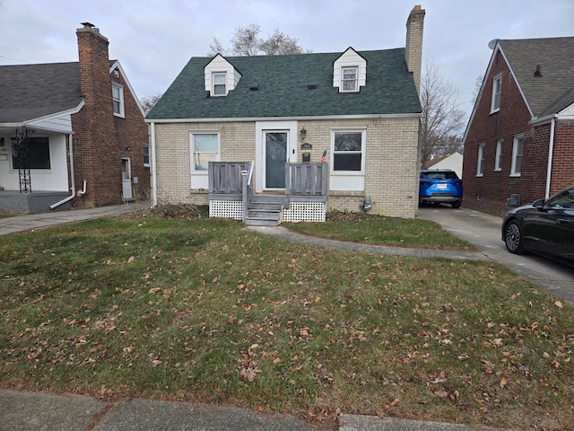 new england style home with a front lawn