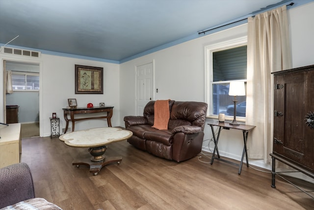 living room with light hardwood / wood-style floors