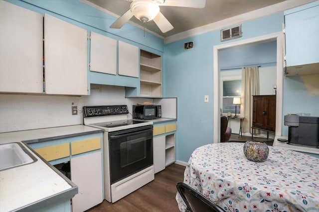 kitchen featuring white range with electric cooktop, dark hardwood / wood-style floors, ceiling fan, ornamental molding, and white cabinetry