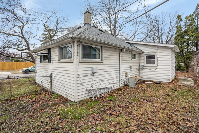 17300 Northrop St, Detroit, MI 48219 - view of property exterior with a chimney and roof with shingles