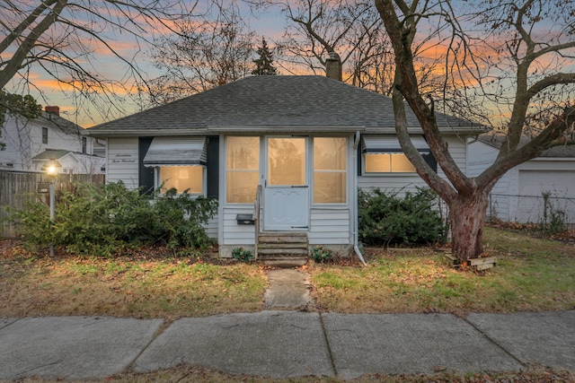 17300 Northrop St, Detroit, MI 48219 - bungalow-style home featuring entry steps, a shingled roof, and a chimney