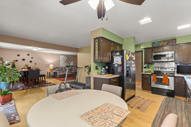 kitchen with tasteful backsplash, dark brown cabinetry, stainless steel appliances, ceiling fan, and light hardwood / wood-style floors