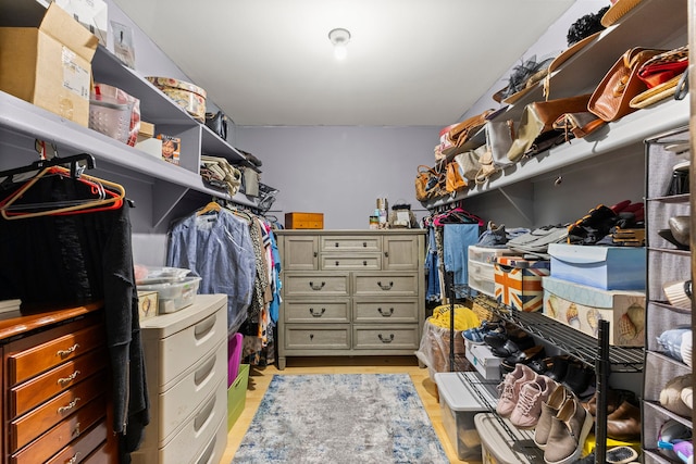 spacious closet with light hardwood / wood-style flooring