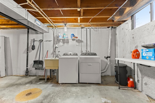 laundry room with washing machine and dryer and sink