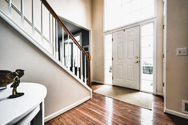 entrance foyer featuring dark hardwood / wood-style flooring