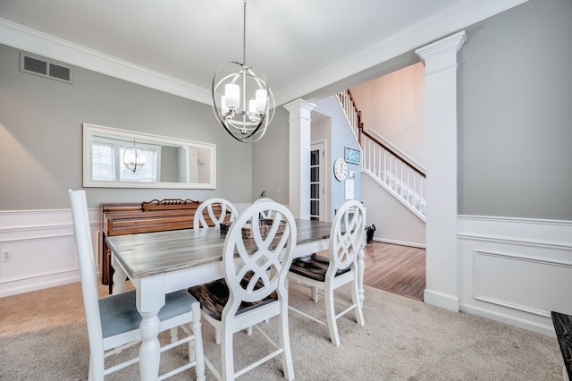 carpeted dining room with a notable chandelier and crown molding