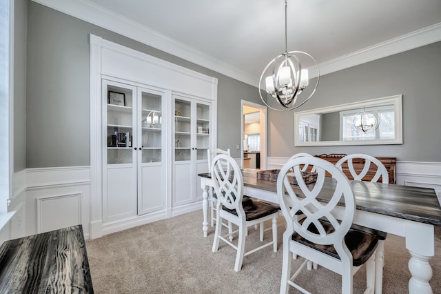 dining space with crown molding, light carpet, and a wealth of natural light