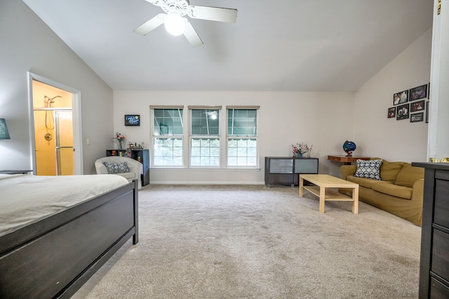 carpeted bedroom with ensuite bath, ceiling fan, and lofted ceiling