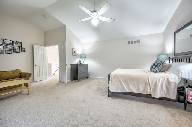 bedroom with ceiling fan, light carpet, and vaulted ceiling