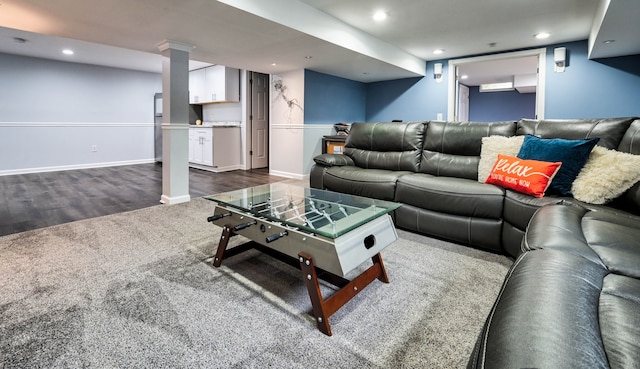 living room with dark hardwood / wood-style flooring