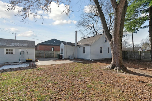 back of property with a patio