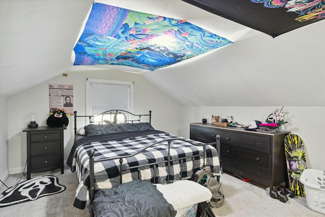 bedroom with vaulted ceiling and light colored carpet