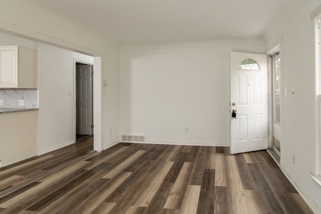 interior space with dark hardwood / wood-style flooring