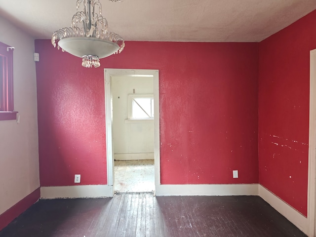 unfurnished room featuring dark hardwood / wood-style flooring