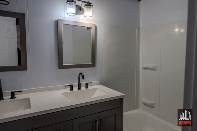 bathroom featuring shower / bathing tub combination and vanity