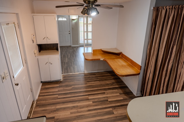 kitchen featuring white cabinetry, ceiling fan, and dark wood-type flooring