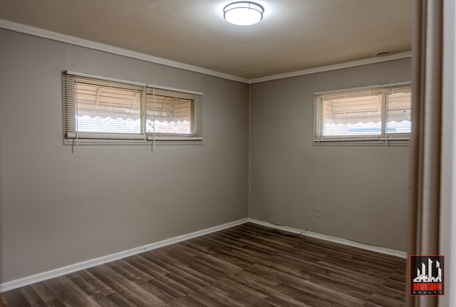 unfurnished room featuring dark hardwood / wood-style flooring and ornamental molding