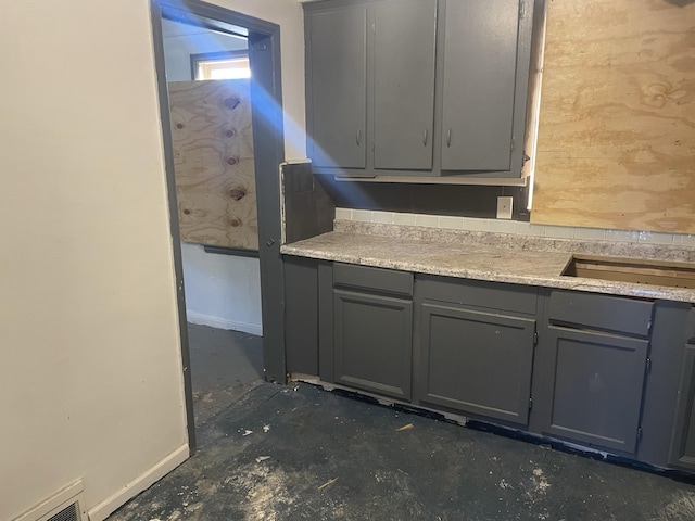 kitchen featuring gray cabinetry