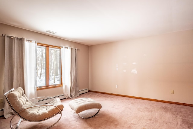 sitting room with light carpet, baseboards, visible vents, and a baseboard heating unit