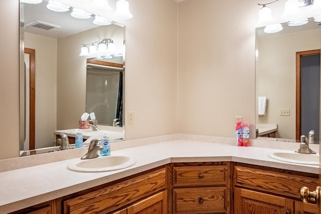 bathroom with vanity and visible vents
