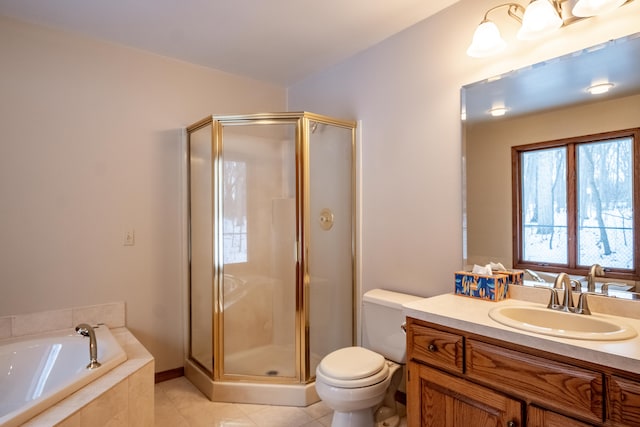 bathroom featuring a bath, a shower stall, vanity, and tile patterned floors