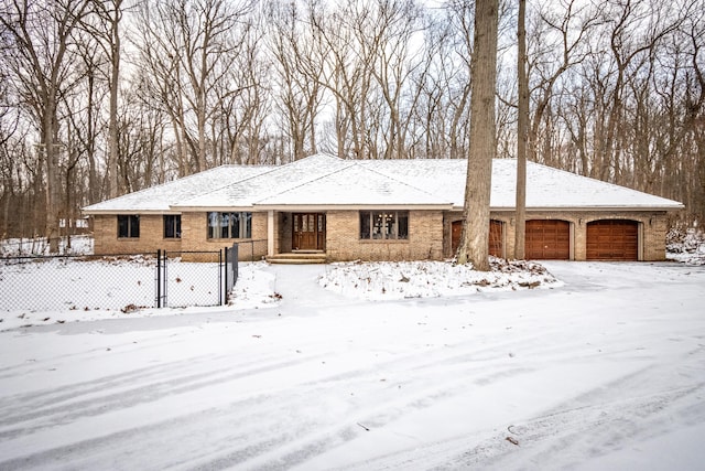 ranch-style house with brick siding and fence