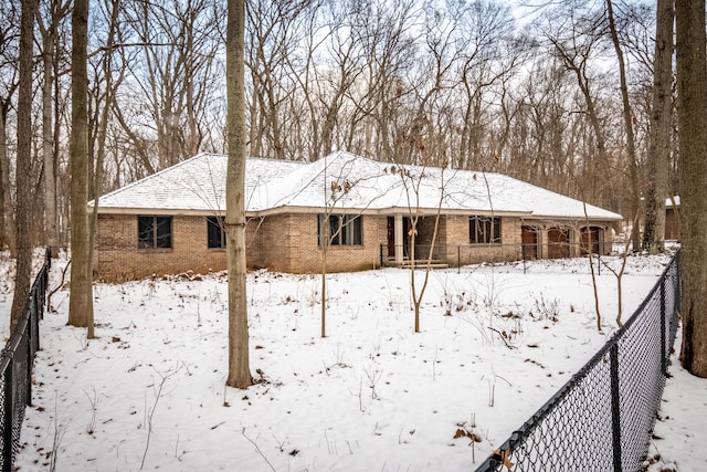 view of snow covered house