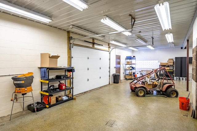 garage with concrete block wall