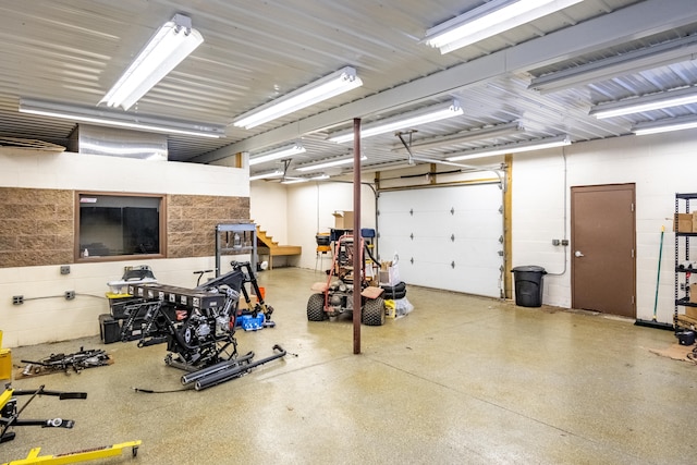 garage with concrete block wall