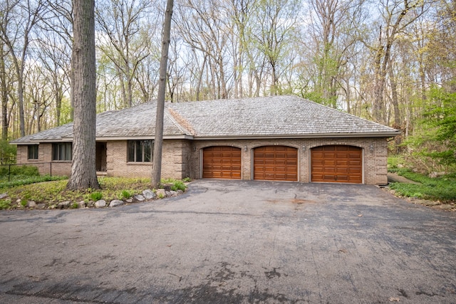 garage featuring driveway